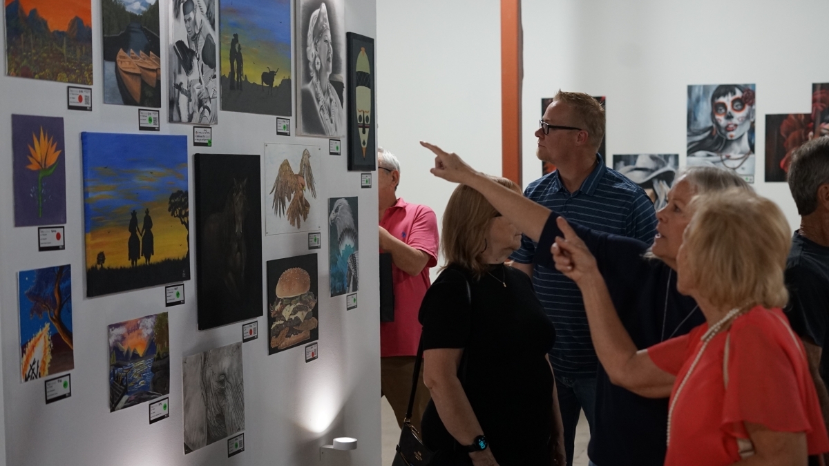 People gathered in an art gallery